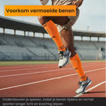 Sporter traint op de atletiekbaan met R2B compressiekousen oranje.