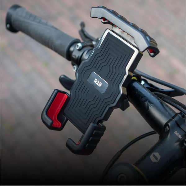 Zwart- en rood r2b-telefoonhouder met textuur voor een stevige grip, ontworpen voor een veilige bevestiging aan fiets stuurhandvatten.